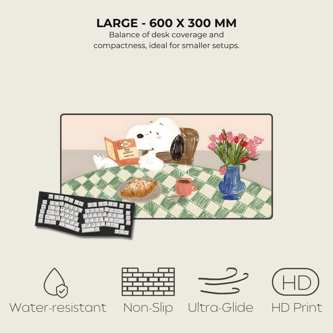 Desk mat with a cartoon dog, flowers, and food items on a checkered tablecloth, with product features listed below.