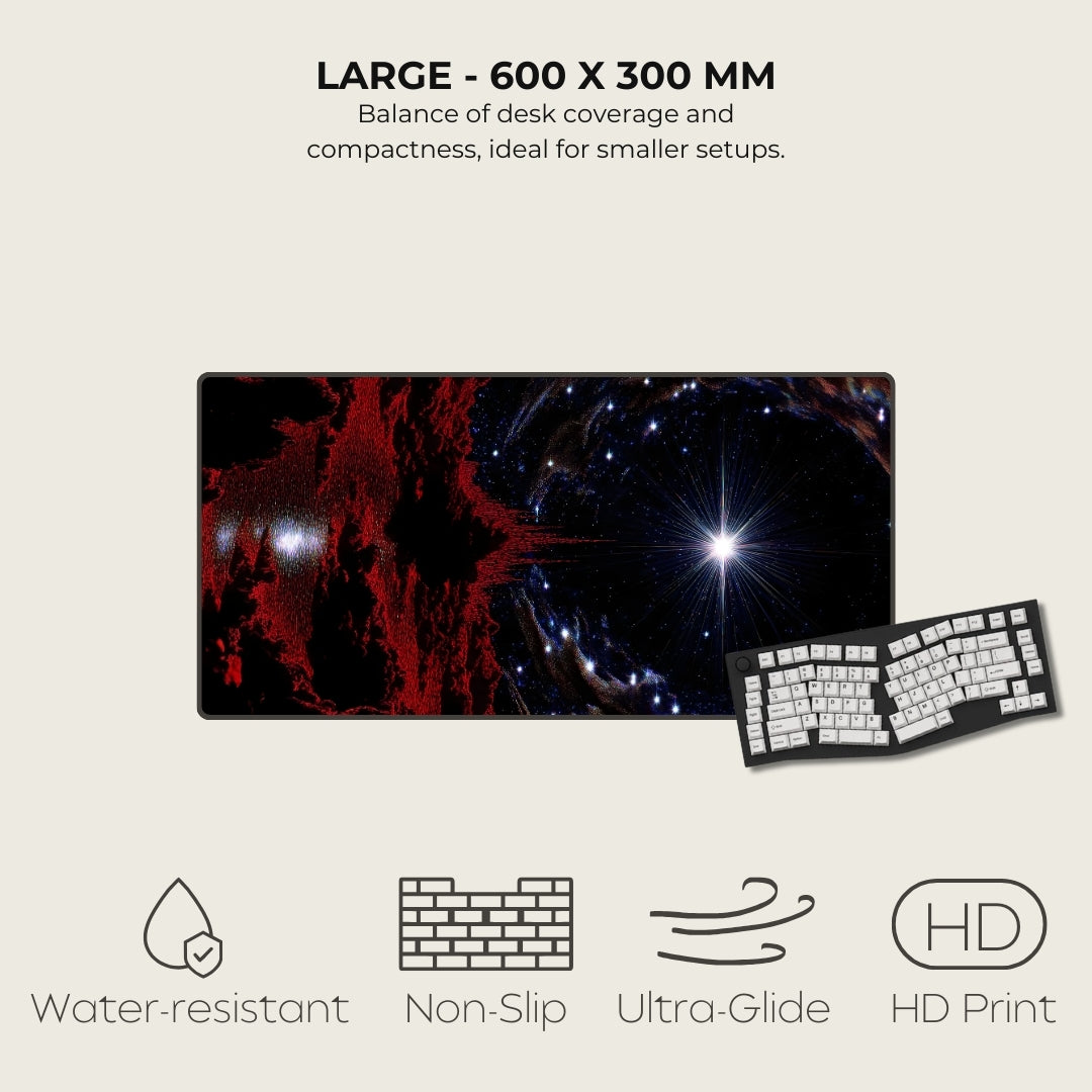 Large desk mat with space-themed design next to a keyboard on a light gray background