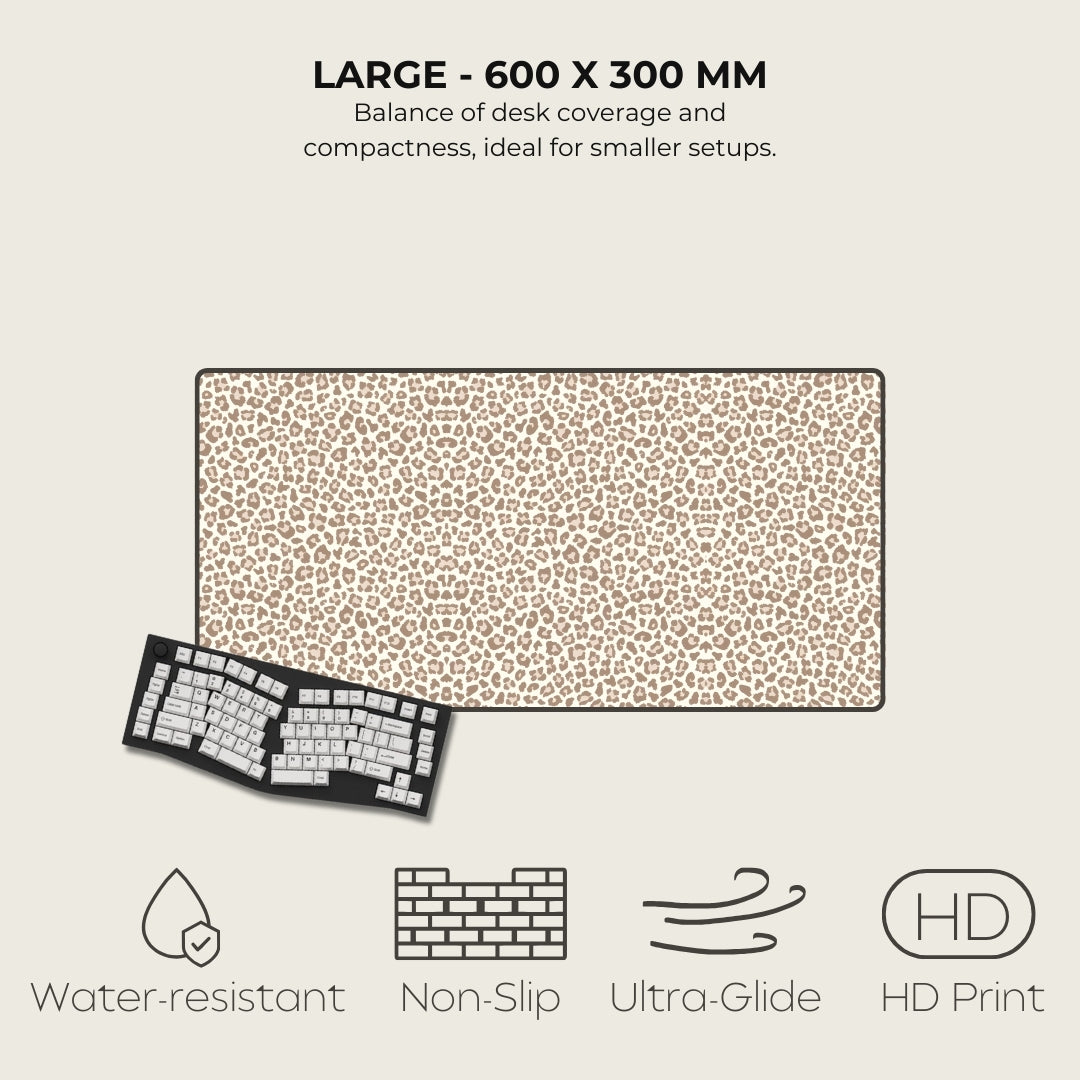 Large desk mat with leopard print design, keyboard, and feature icons on a beige background
