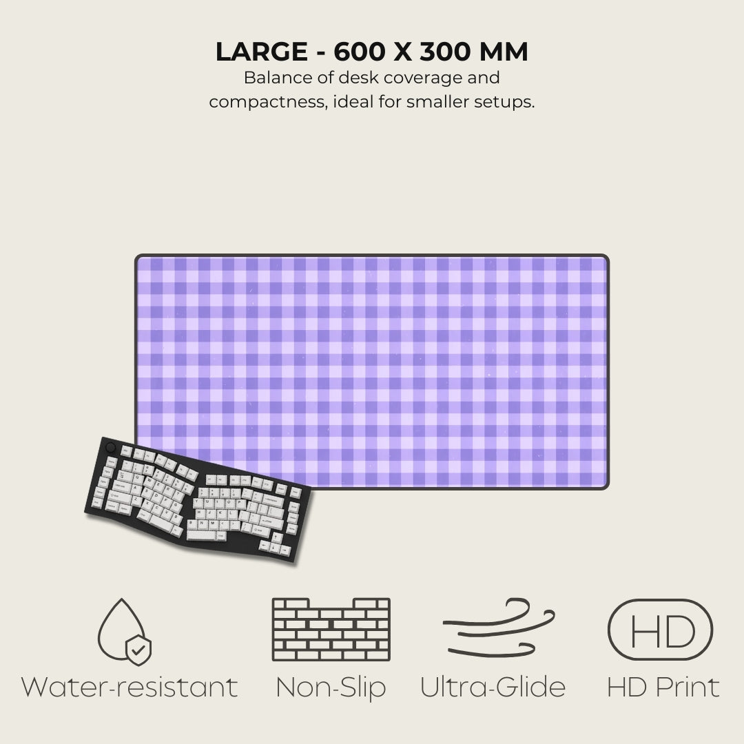 Large desk mat with purple and white checkered pattern, keyboard on the side, and feature icons below.