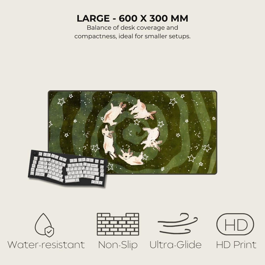 Large desk mat with cat design, size 600 x 300 mm, on a light beige background.