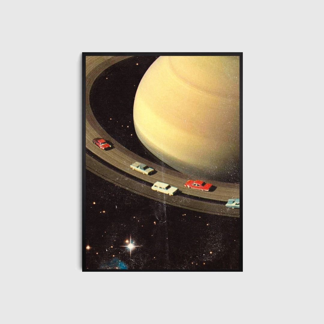 Framed poster of a space scene with Saturn and spacecraft.