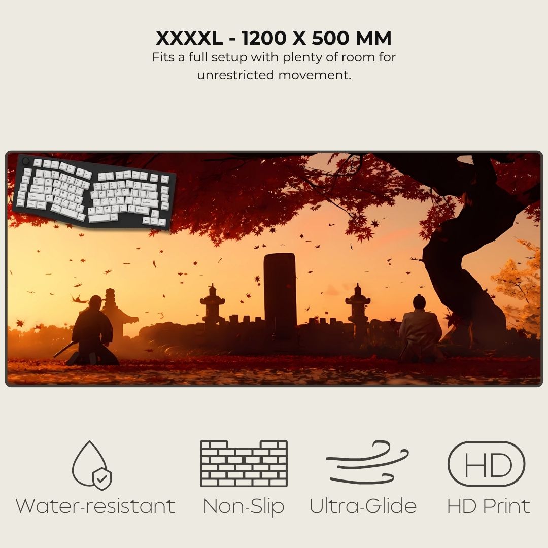 XXXXL desk mat with scenic design of people sitting under a tree, featuring a keyboard on a sunset background.