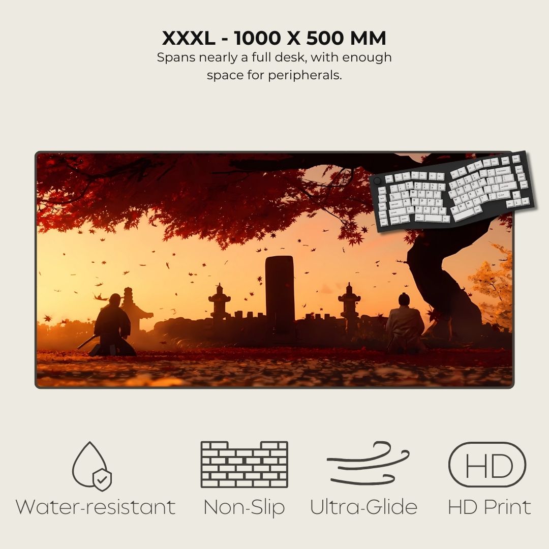 XXXL desk mat with scenic design of people sitting under a tree, featuring a keyboard on a sunset background.