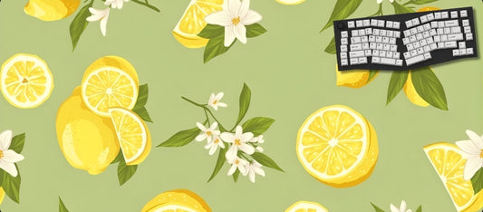 Desk mat with lemon and flower pattern and keyboard on a green background