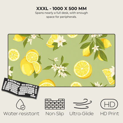 Large desk mat with lemon and flower pattern, featuring text and icons indicating product features.