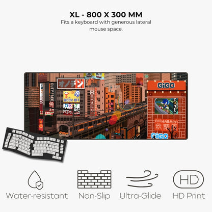 An XL-sized desk mat featuring a colorful retro Japanese city street scene, shown with a keyboard overlay and text highlighting features like water resistance, non-slip grip, ultra-glide surface, and HD print.