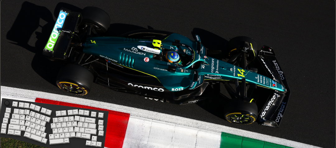 Formula 1 car on a track with a keyboard and flag in the foreground