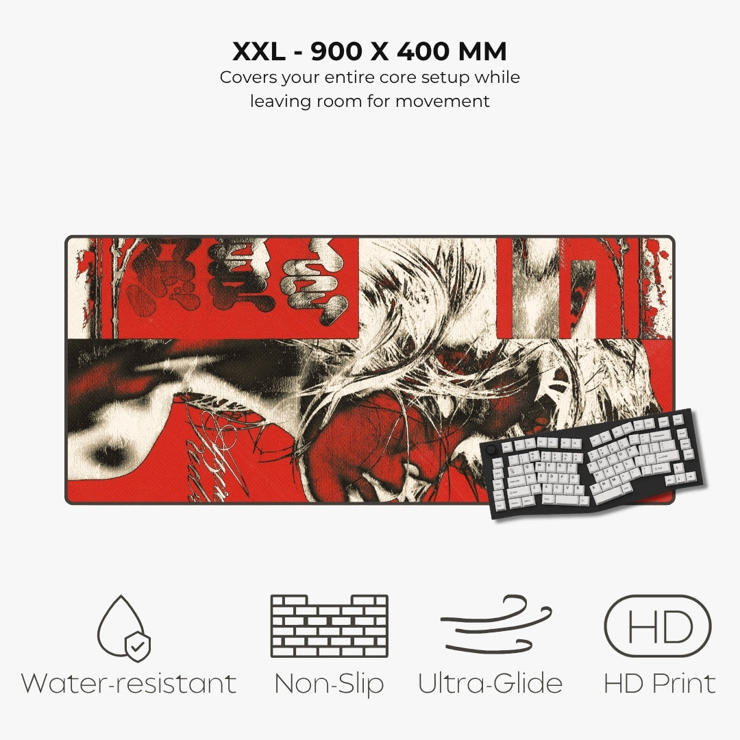 An XXL size desk mat with a red, black, and white graphic print of a woman's face, shown with a keyboard on top. The image includes text specifications and feature icons for water resistance, non-slip, ultra-glide, and HD print.