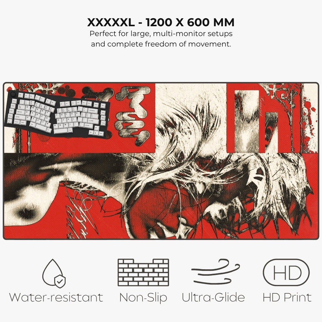 A large desk mat or mousepad shown on a light gray background with text reading 'XXXXXL - 1200 X 600 MM' and feature icons for water resistance, non-slip, ultra-glide, and HD print. The mat has a bold red, black, and white abstract collage-style print with a keyboard graphic and brushstroke details.