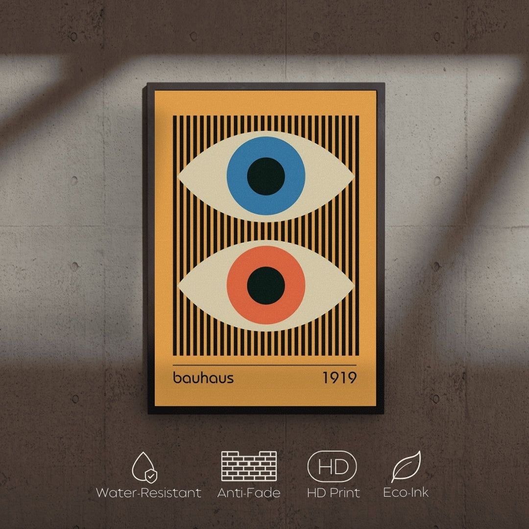 Framed artwork with abstract eyes design on a textured wall.