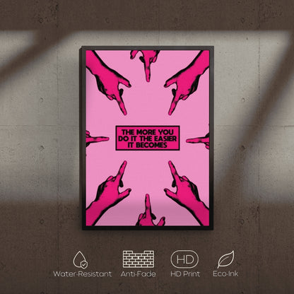 Framed poster with pink graphic design and text on a textured wall.