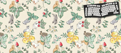 Desk mat with animal and floral pattern featuring a keyboard on a white background