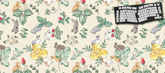 Desk mat with animal and floral pattern featuring a keyboard on a white background