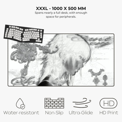 A large desk mat or mouse pad shown on a light gray background with text reading 'XXXL - 1000 X 500 MM' and feature icons for water resistance, non-slip, ultra-glide, and HD print. The mat has a monochrome artistic illustration of a woman's profile with ornate decorative details.