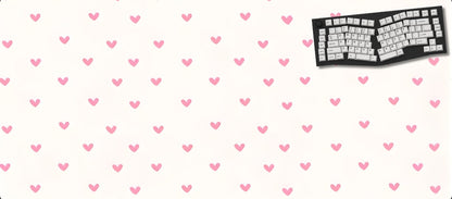 Large mouse pad with pink heart pattern and a keyboard on a white background