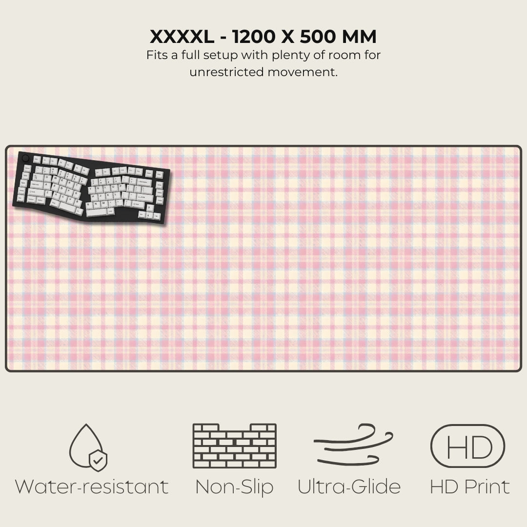 Large desk mat with pink and white checkered pattern, keyboard illustration, and feature icons on a white background.