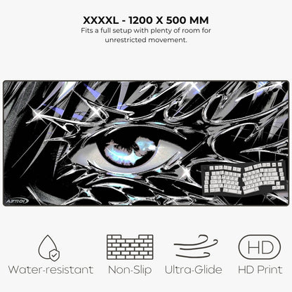 A large rectangular gaming desk mat with a black-and-white anime-style eye graphic and a keyboard shown on top, with text reading 'XXXXL - 1200 X 500 MM' and feature icons for water-resistant, non-slip, ultra-glide, and HD print.