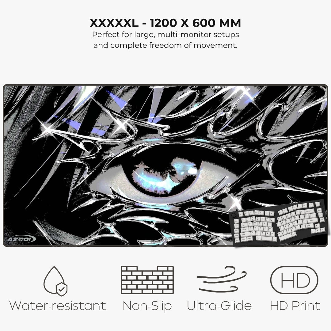 A large gaming desk mat with a black and white anime-style graphic mousepad featuring a prominent eye and keyboard illustration. The image includes text at the top reading 'XXXXXL - 1200 X 600 MM' and feature icons at the bottom for Water-resistant, Non-Slip, Ultra-Glide, and HD Print.