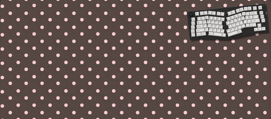 Polka dot mouse pad with keyboard on a dark background