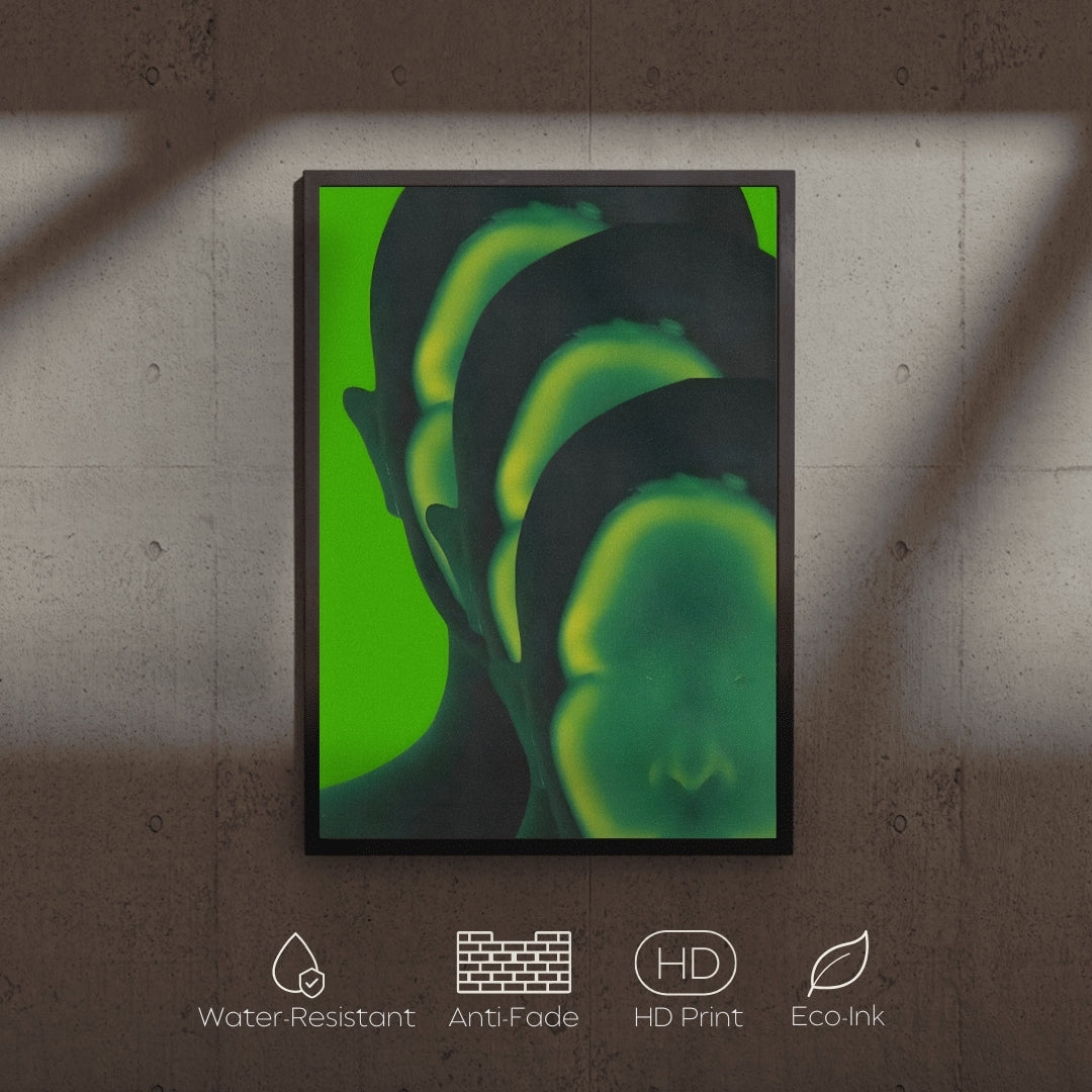 Framed abstract art with green and black colors on a textured wall.