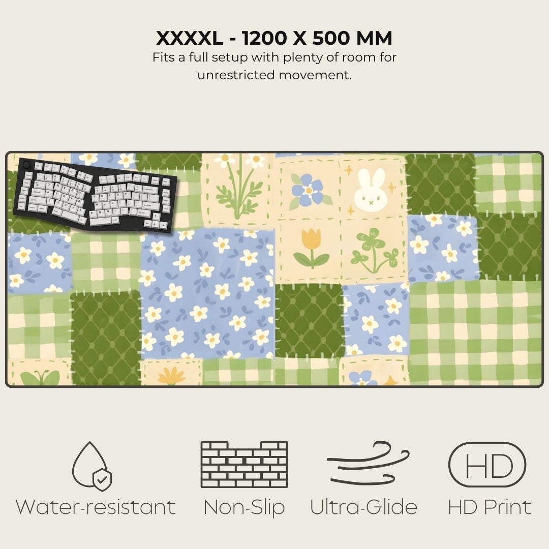 Large desk mat with a floral and checkered pattern, featuring a keyboard on top.