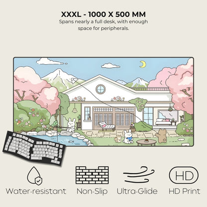 Large desk mat with cartoon house design, keyboard, and product features on a white background