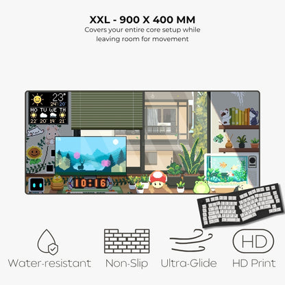 An XXL desk mat featuring a colorful cartoon-style room scene with a computer setup, plants, books, and characters, shown with text highlighting its 900 x 400 mm size and features like water resistance, non-slip, ultra-glide, and HD print.