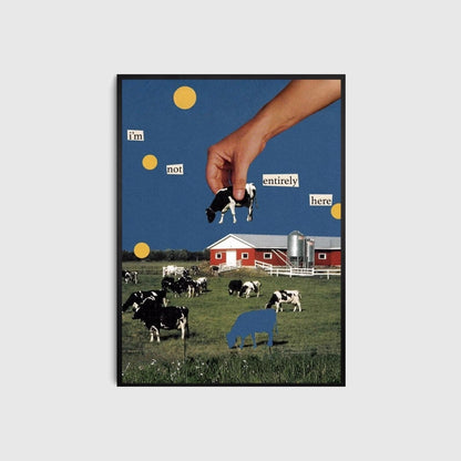 Framed artwork with cows in a field, a hand, and text on a blue sky background.