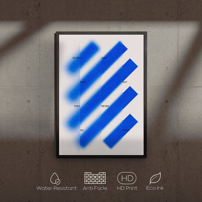 Framed artwork with blue abstract design on a textured wall