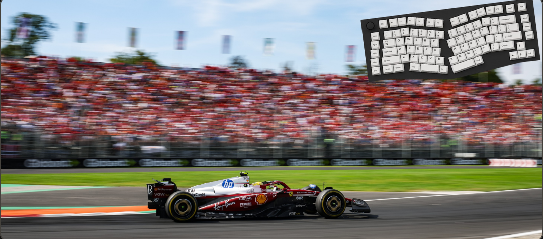 Formula 1 car racing on a track with a large crowd in the background