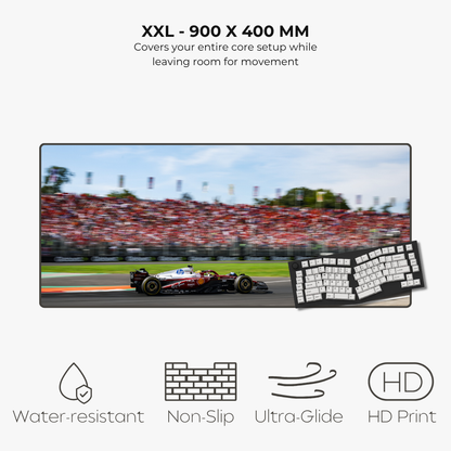 Large mousepad displaying a racing game with keyboard on a white background, featuring text and icons about product features.