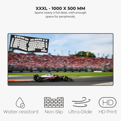 Large mousepad displaying a racing car on a track with text about size and features.