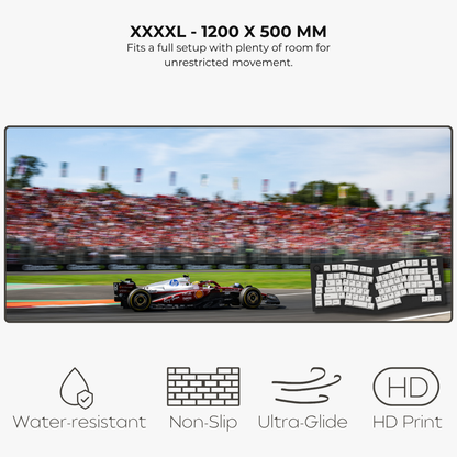 Large screen displaying a Formula 1 race with text about size and features.