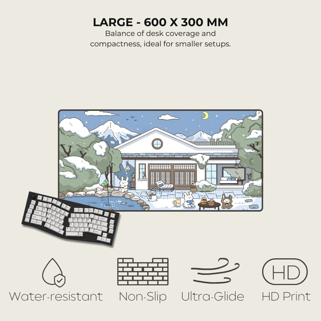Desk mat with cartoon design of a house and mountains, featuring text on size and features.