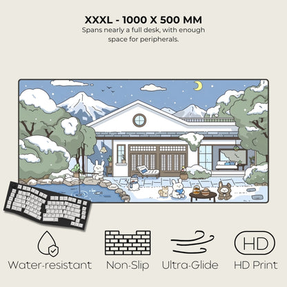 Large desk mat with cartoon house design, keyboard on the left, and product features listed.