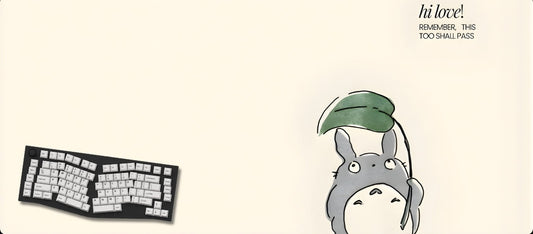 Desk mat with cartoon character and keyboard illustration on a beige background