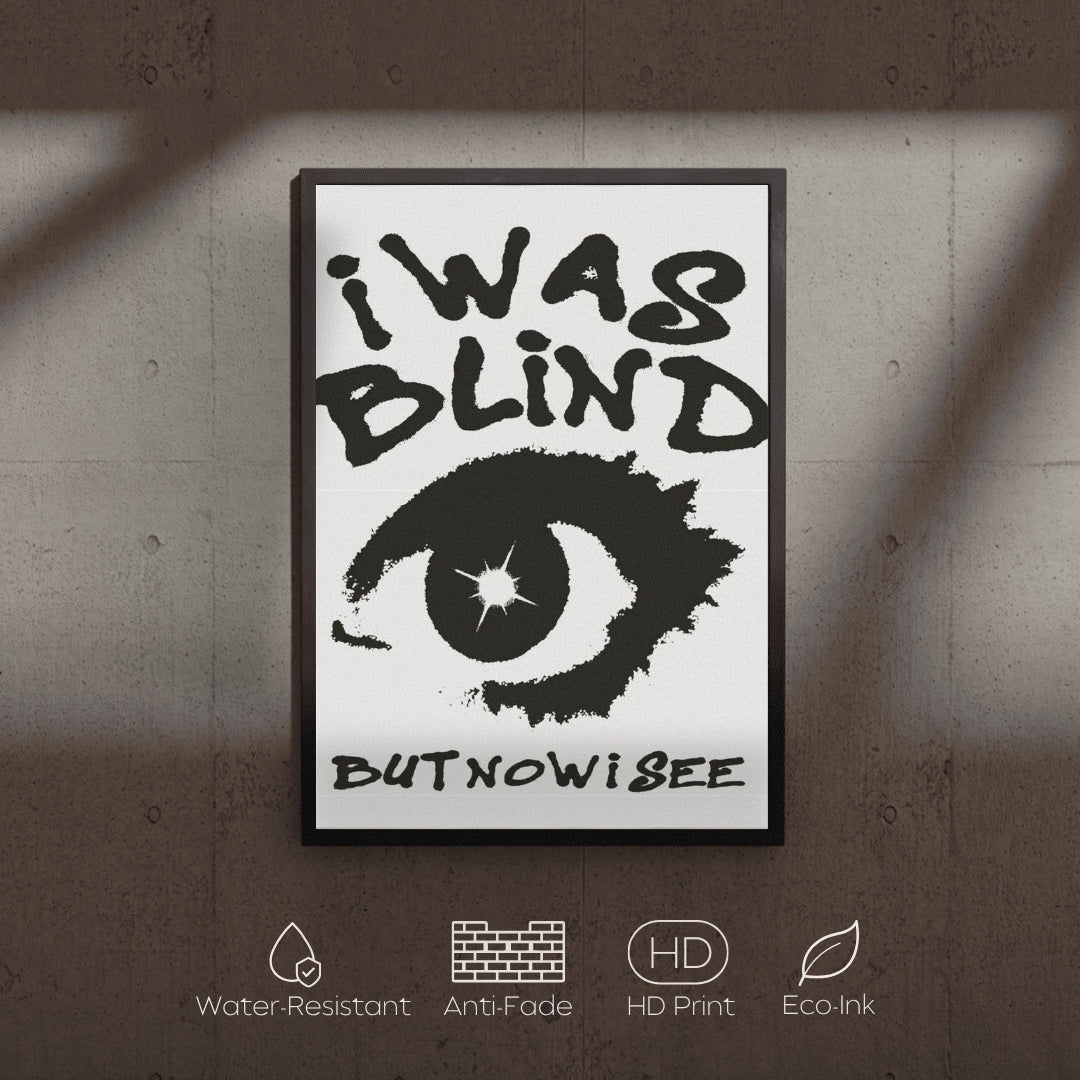 Framed poster with an eye illustration and text 'i was blind but now i see' on a textured wall.