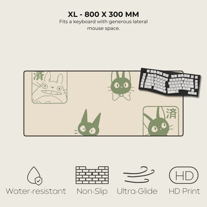 Large mouse pad with cartoon cat designs and a keyboard on a beige background