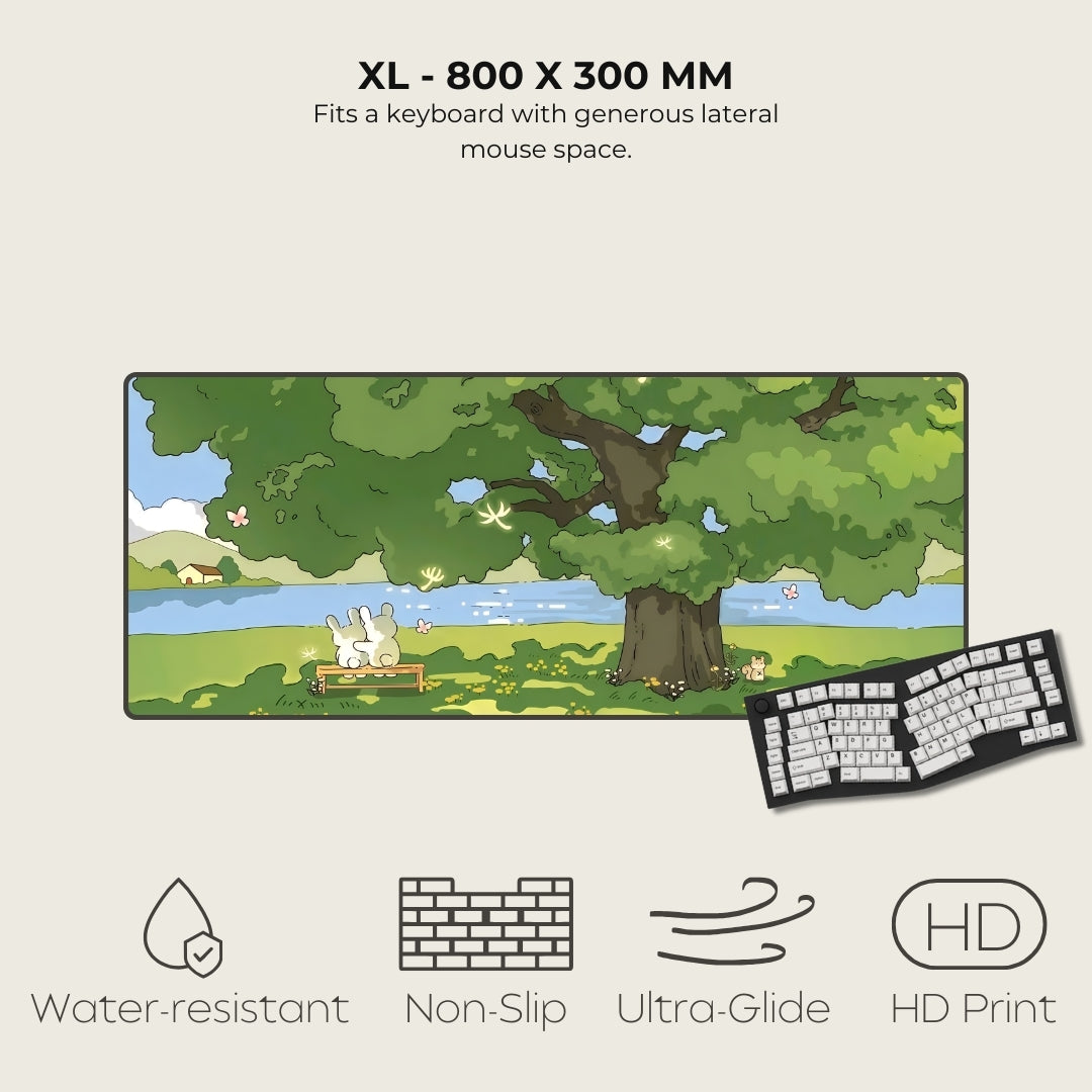 Large mouse pad with nature design, keyboard on the side, and product features listed.