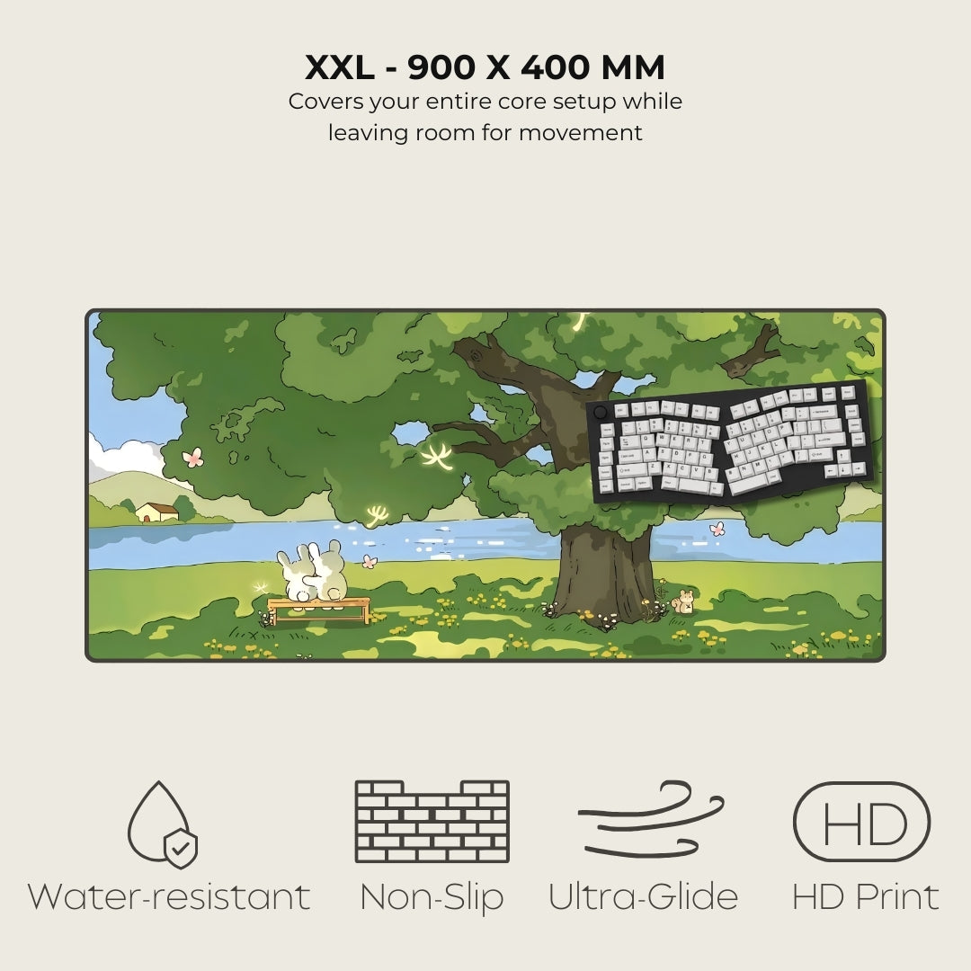 Keyboard mat with nature design, featuring a tree, bench, and keyboard, on a light gray background.