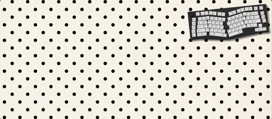 Keyboard on a pegboard with a white background