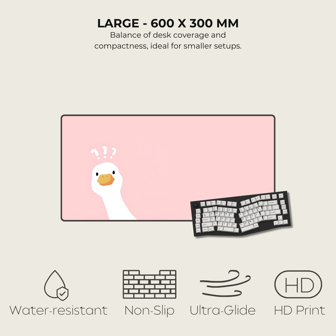 Large desk mat with cartoon duck design next to a keyboard, featuring text and icons about product features.