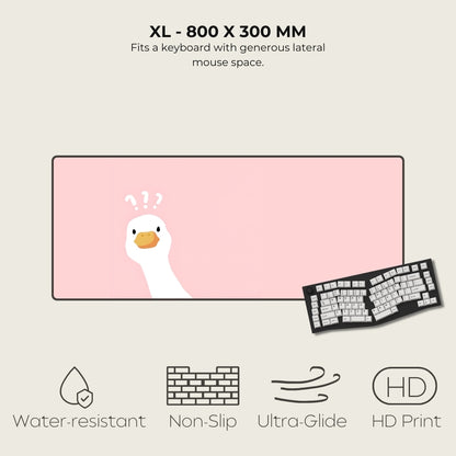 Large pink mouse pad with a cartoon duck design, featuring text and icons indicating product features.