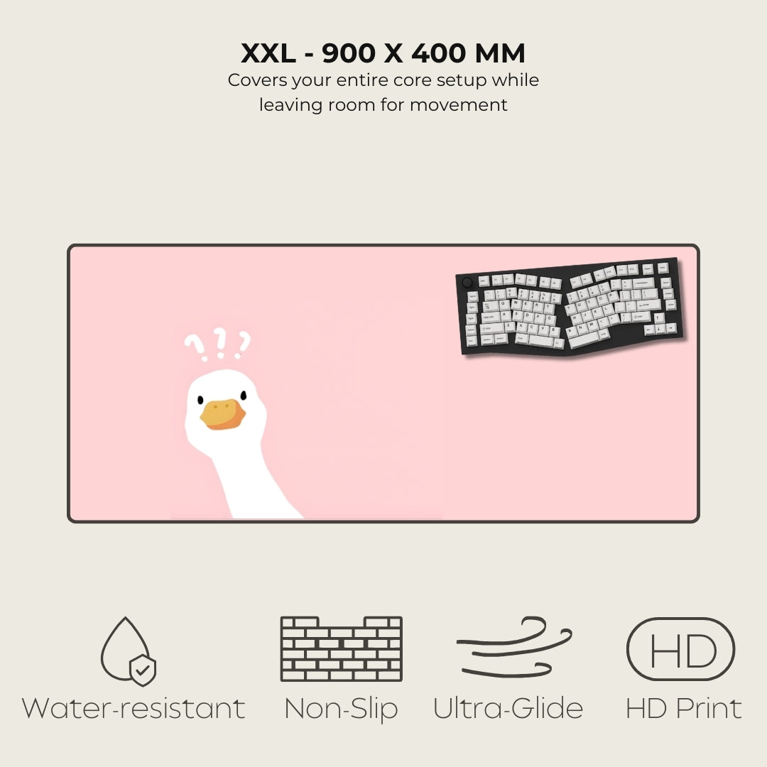 Large pink mouse pad with cartoon duck design and keyboard illustration, featuring text on size and features.