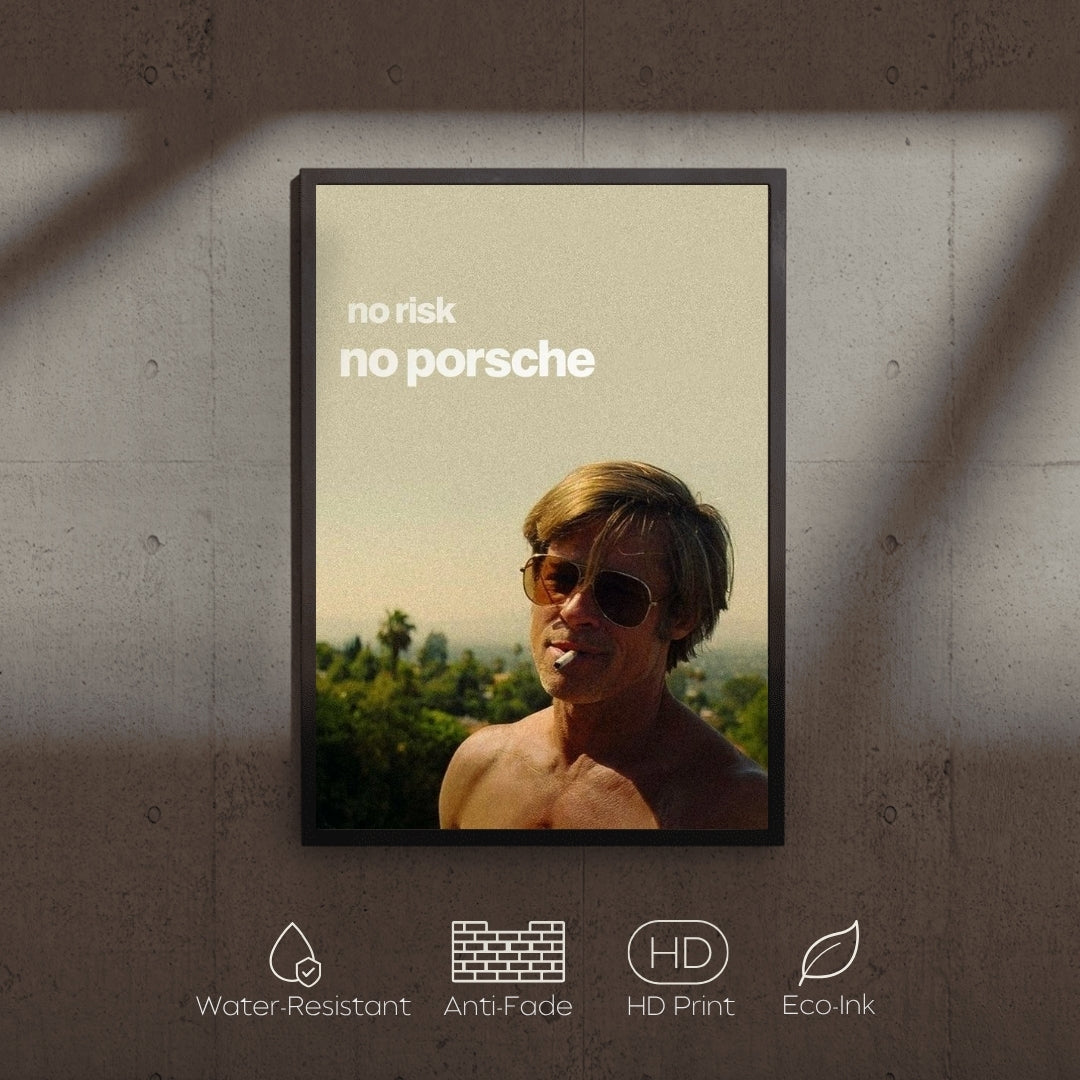 Framed poster with a man wearing sunglasses and text 'no risk no porsche' on a concrete wall.