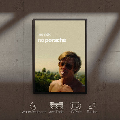 Framed poster with a man wearing sunglasses and text 'no risk no porsche' on a concrete wall.