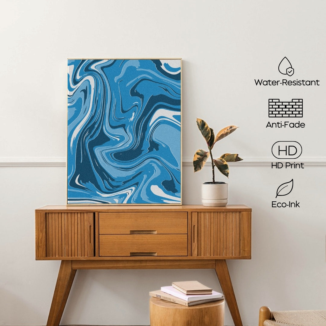 Wooden console table with a blue abstract painting, plant, and books against a white wall.