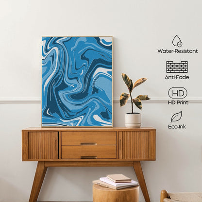 Wooden console table with a blue abstract painting, plant, and books against a white wall.
