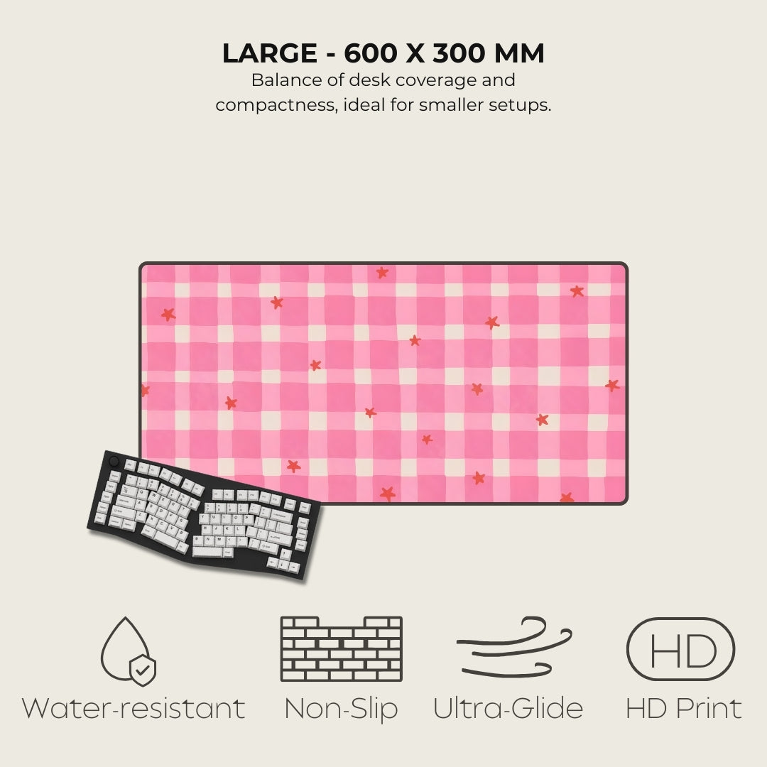 Pink checkered desk mat with keyboard on a light gray background, featuring text and icons about product features.